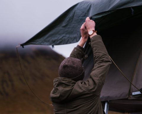 Man setting up tent