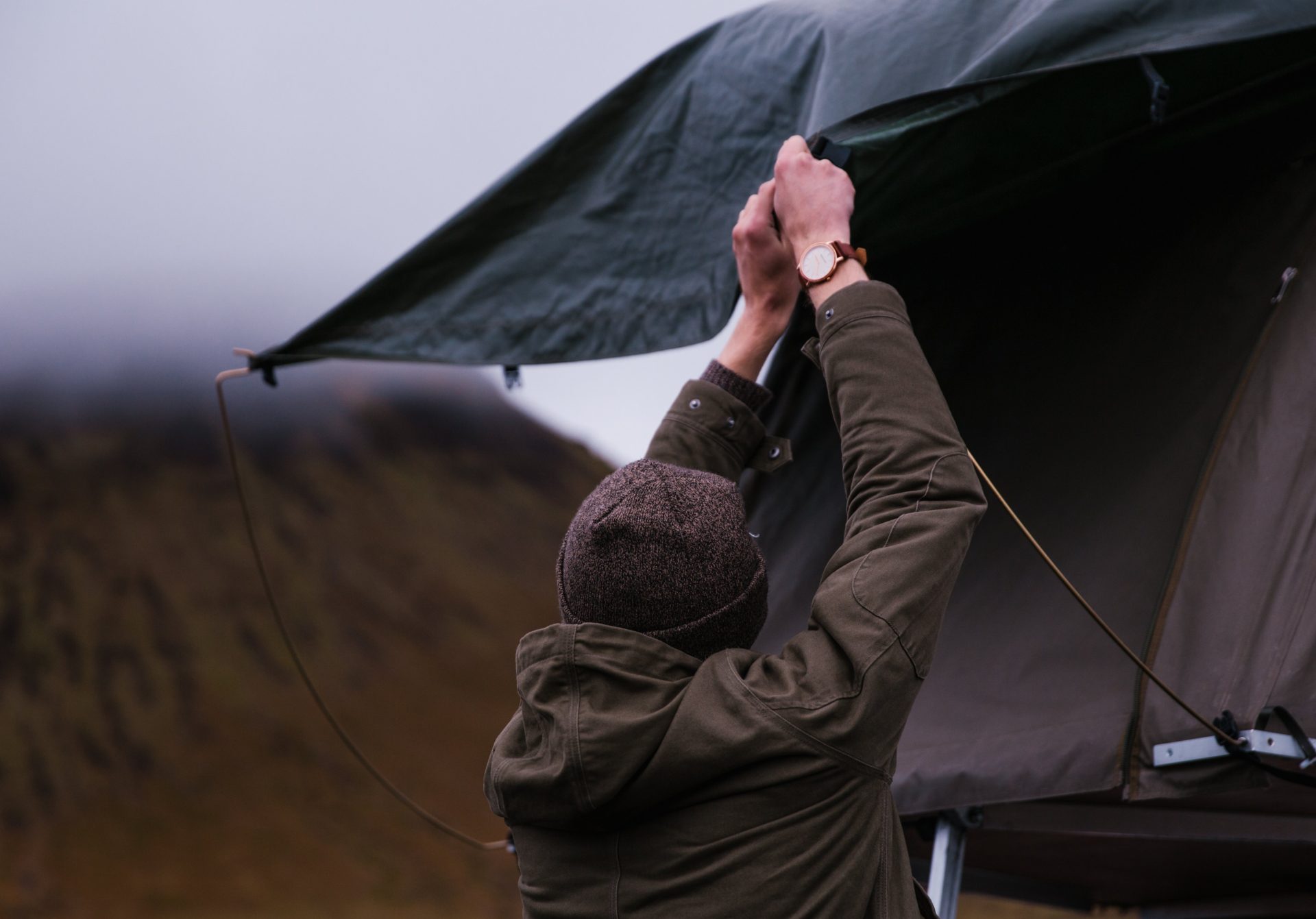 Man setting up tent