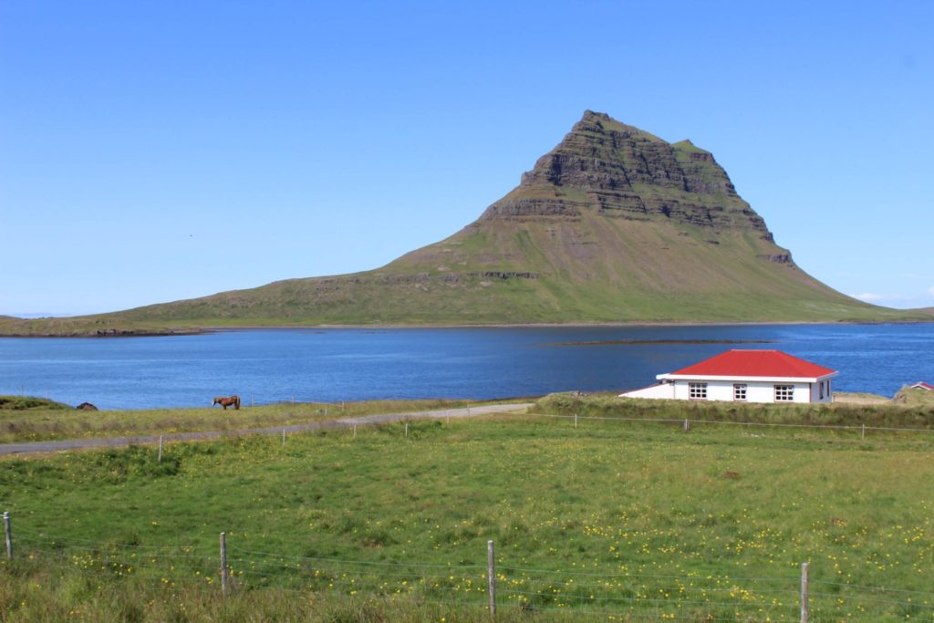 Kirkjufell with horses and a beach house