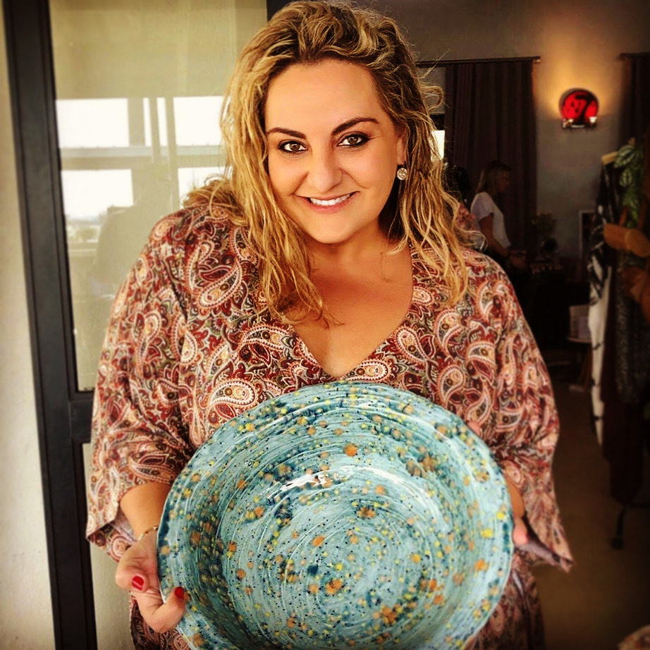 Woman holding ceramic bowl
