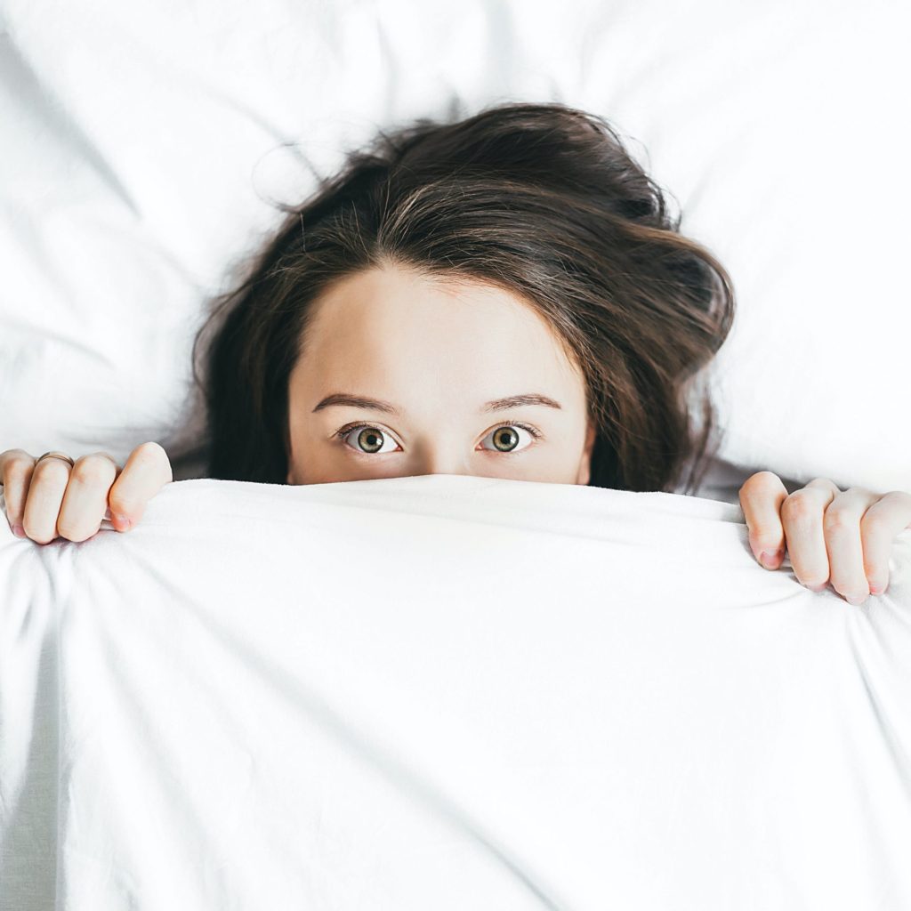 Woman awake in bed