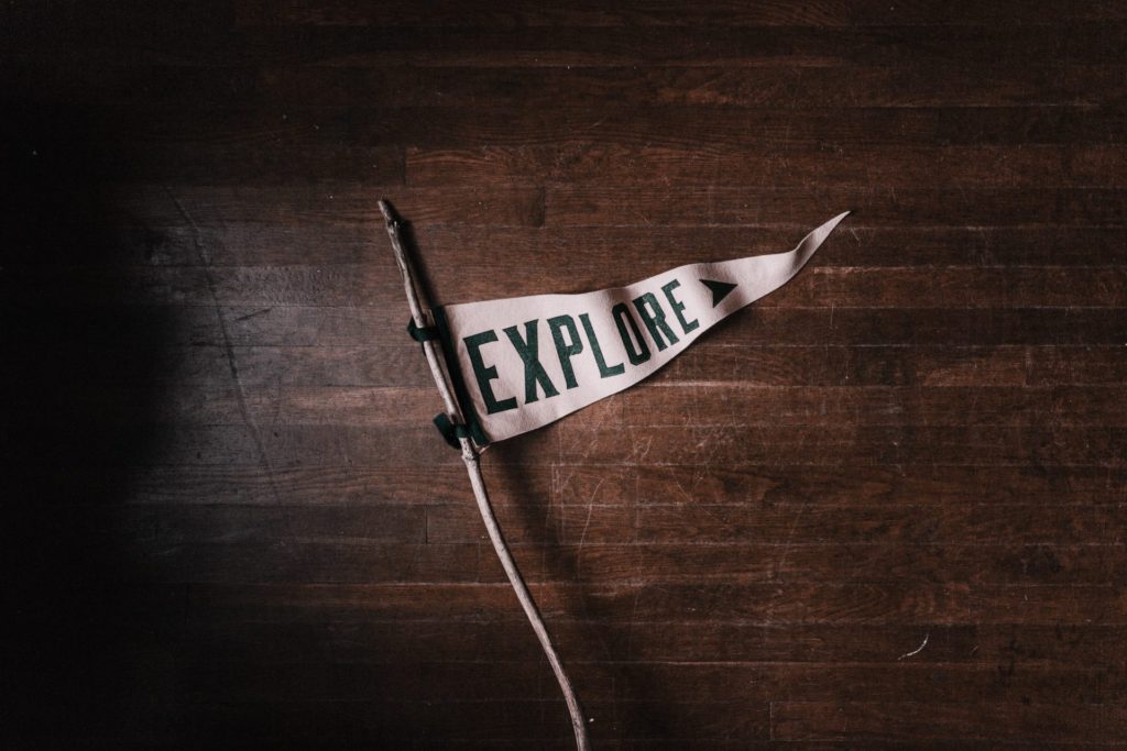 Flag on table with the word 'explore'