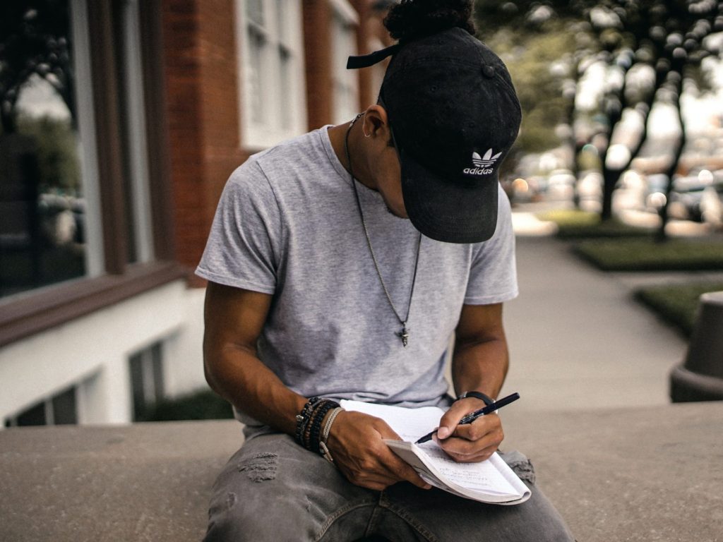 Man writing in book