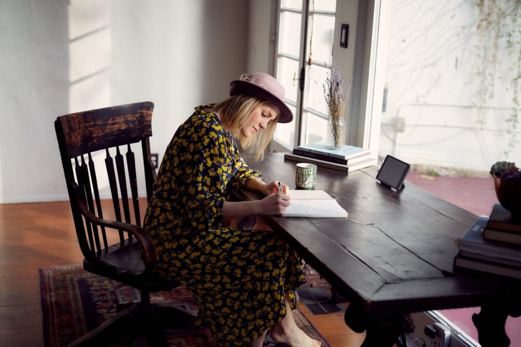 Woman writing at table