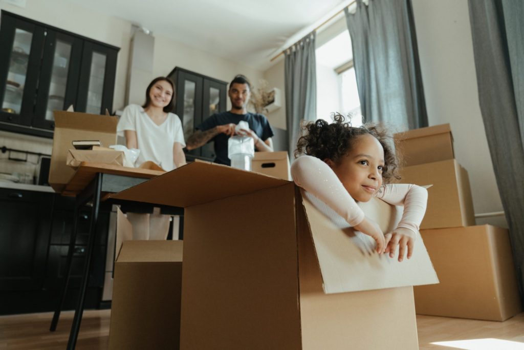 Child in box; family moving