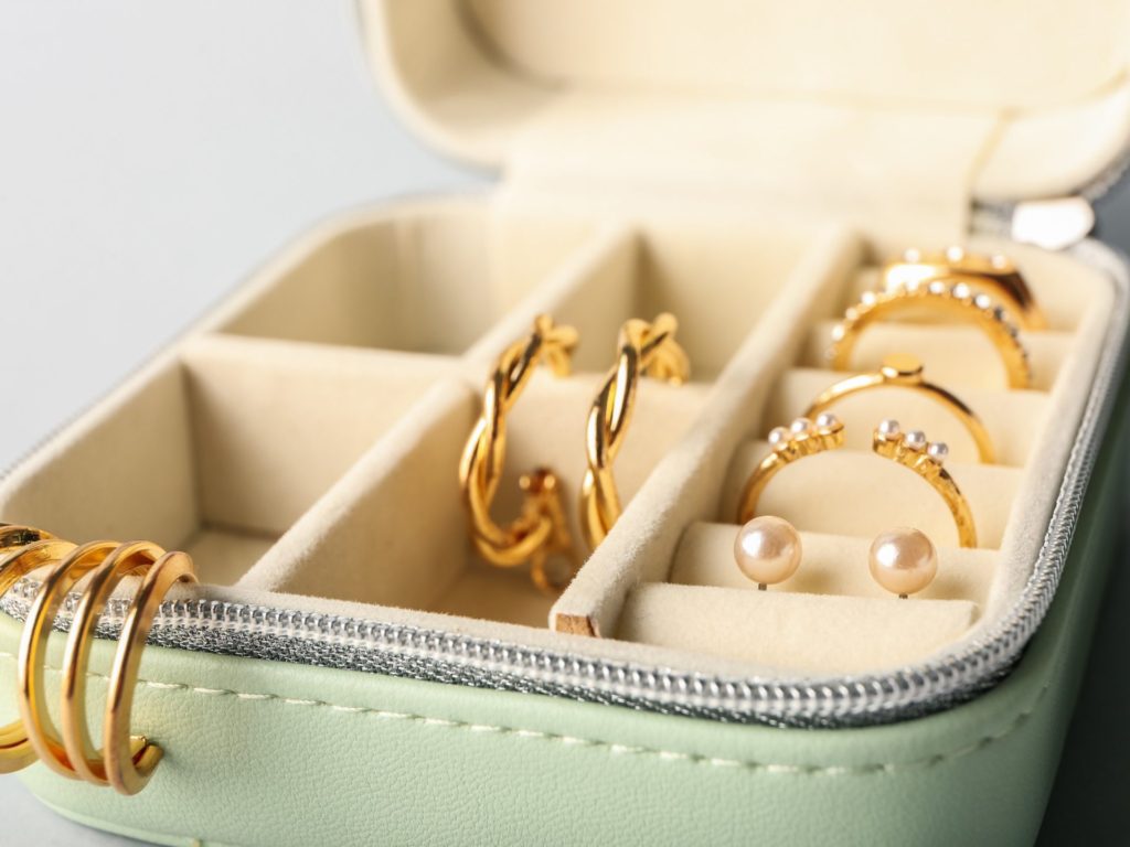 Open jewellery box with rings and earrings